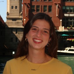 Portrait of Estela Westphalen in a yellow blouse along the Chicago River.